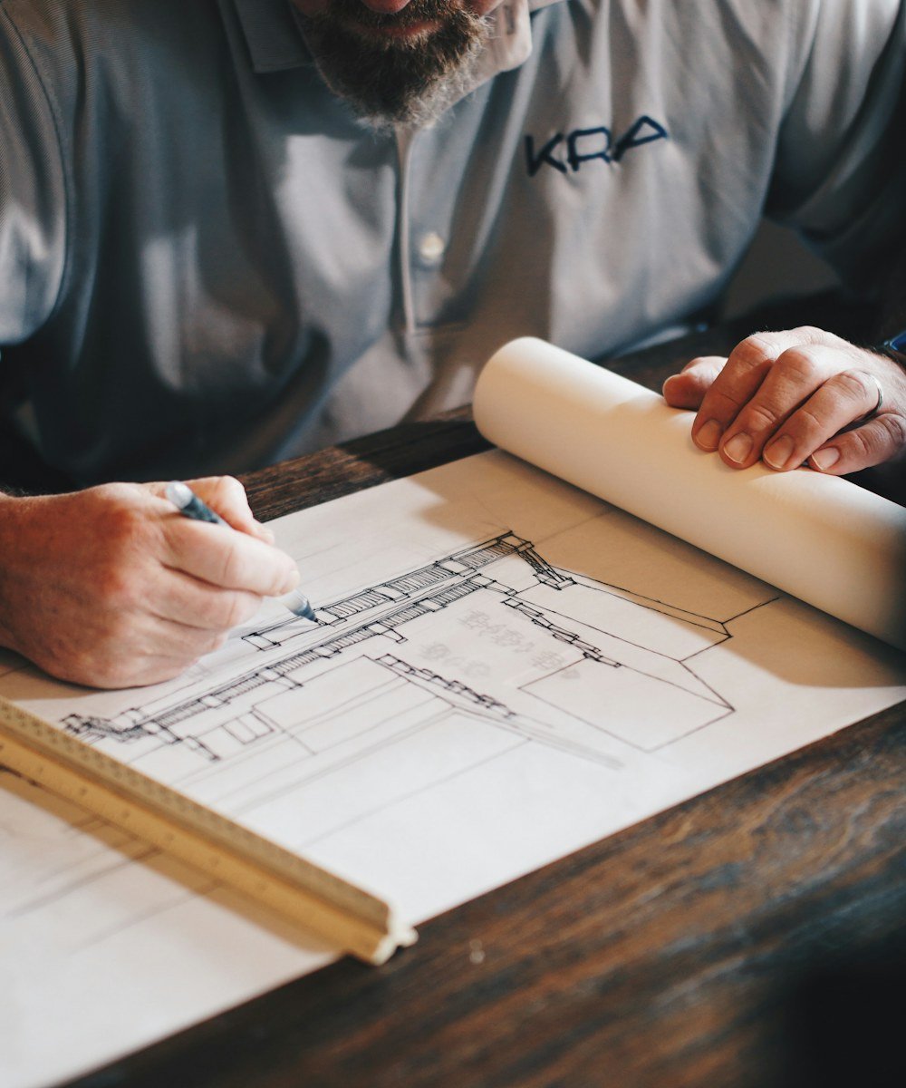 Ottawa handyman reviewing project plans at a workbench.