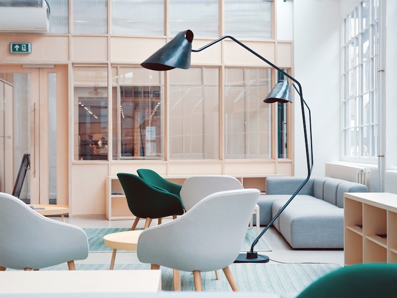 Modern small-office common area with seating and good natural light — typical commercial maintenance setting.